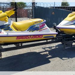 2 Bombardie Jetski With Trailer And 6 Fuel Baskets