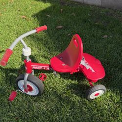 Radio Flyer Red Rider Trike, featuring a steel frame, adjustable seat, and quiet ride wheels