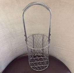 Silver wire mesh wine holder.