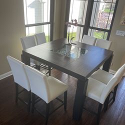 Contemporary High Table and 8 Leather Chairs.