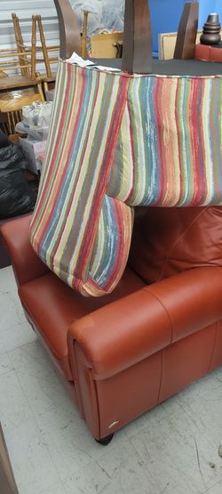 Ashley 5 piece living room suit. Orange in color
