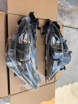 New OEM MAZDA 3 headlight pair