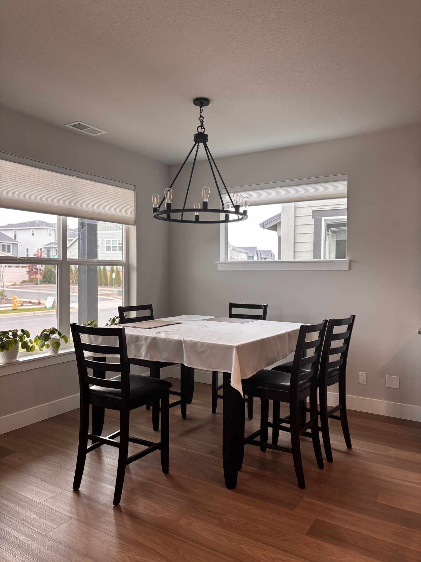Real wood 8 seat dining table with leather seated chairs