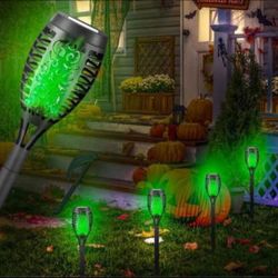 New Green or purple flickering flame 🔥 solar torch lights. Great Halloween decor. 23" tall x 4" wide $6 each