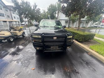 Black Chevrolet SUV with Brush Guard