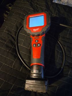 Milwaukee  camera  with  battery and charger