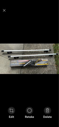 CargoLoc 2-Piece Adjustable Roof Top Cross Bar Set designed for vehicles with existing raised side rails.