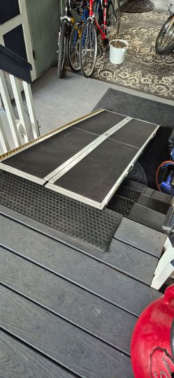 Foldable Ramp for wheelchairs, hand truck, and pets.