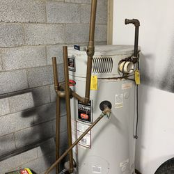 Hot Water Heater As Is And Copper Pipe.