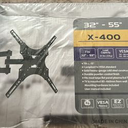 Full Motion TV Wall Mount 32”–55”, adjustable tilt, new in box.
