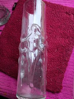 A Tall Glass with a woman on It