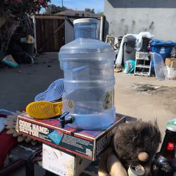 5-gallon reusable PET plastic water bottle equipped with a screw-in push/pull valve