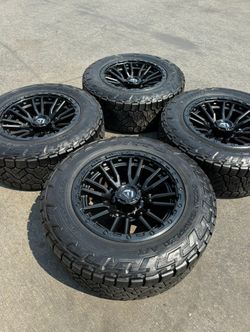 FINANCING AVAILABLE Fuel Rebel 20" 8x170 Wheels with 35' Nitto Recon Grappler All-Terrain Tires