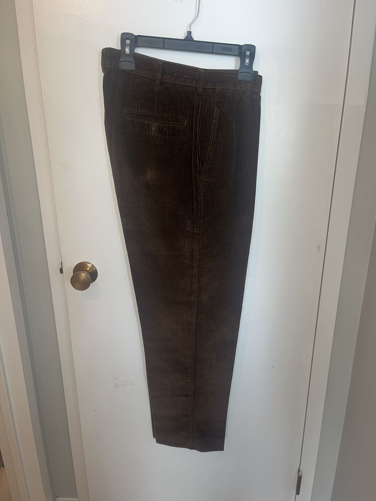 Elegant dark brown corduroy pants. Ideal for versatile wear. Mint Condition.