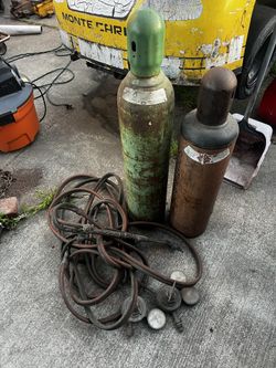Cutting Torch With Oxygen And Acetylene Tanks