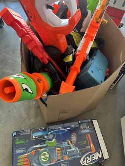 Box of nerf guns and gear