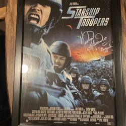11 BY 17 AUTOGRAPHED STARSHIP TROOPERS POSTER