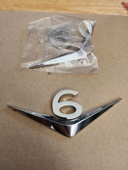 V6 Emblem