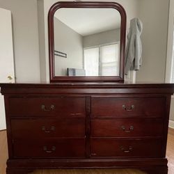 A used Full Wooden Brown 6 Storage dresser with mirror 