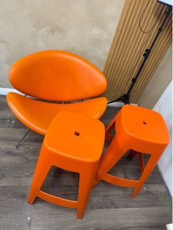 orange chair and stools