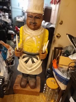 Restaurant      big wooden statue of a cook