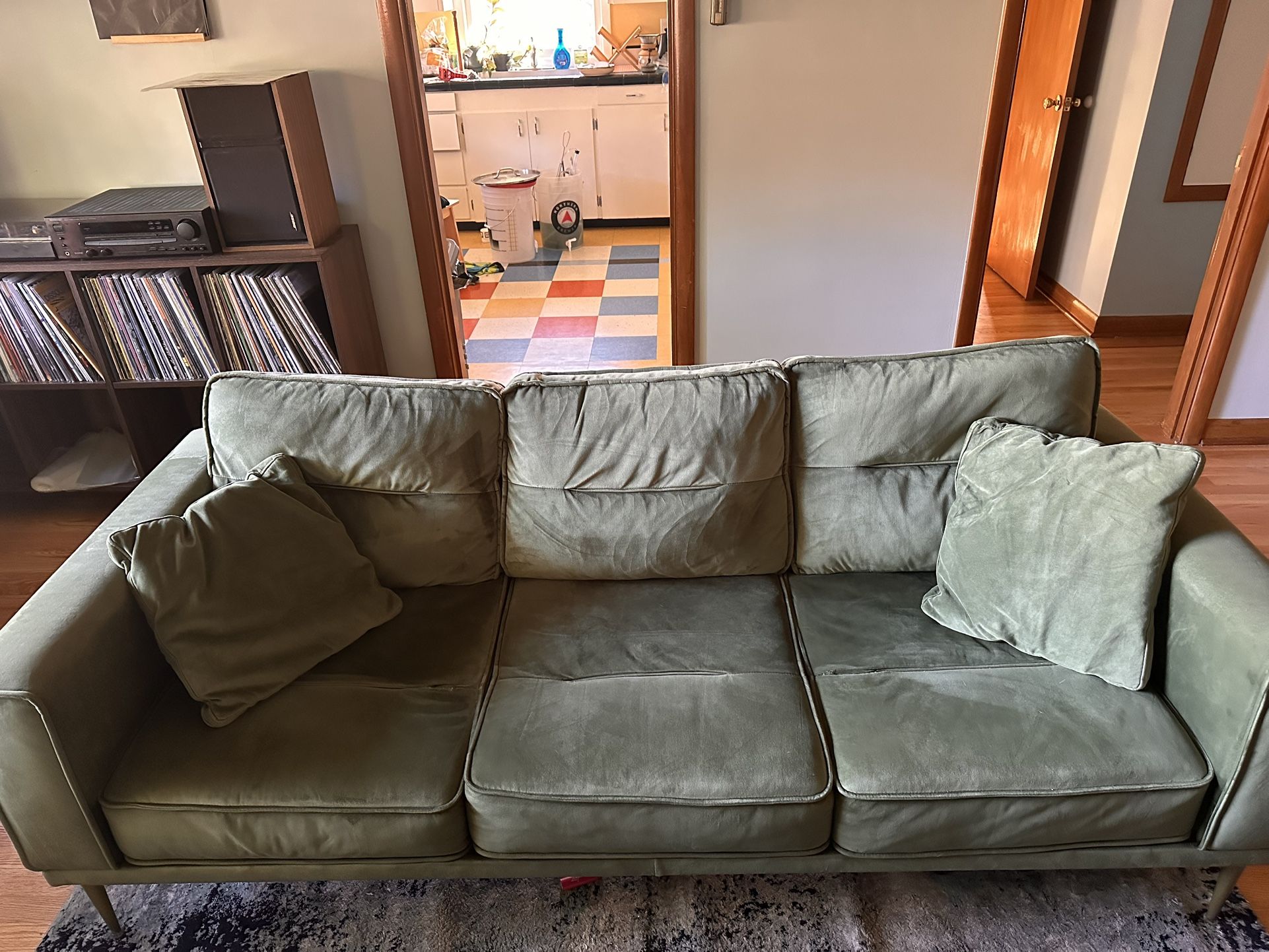 Green velvet couch from Ashley Furniture