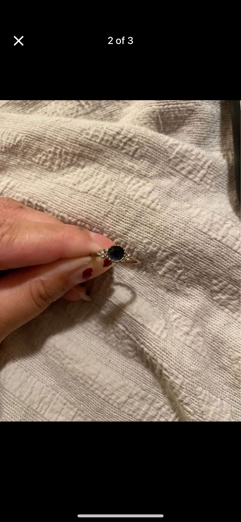 Dark blue ring with diamond accents