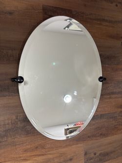 Oval Beveled Wall Mirror with Oil Rubbed Bronze Pivot Mounts