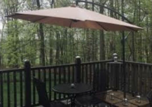 Outdoor umbrella and fire pit table