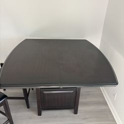 Dark oak wood kitchen table with chairs and leaf attachment