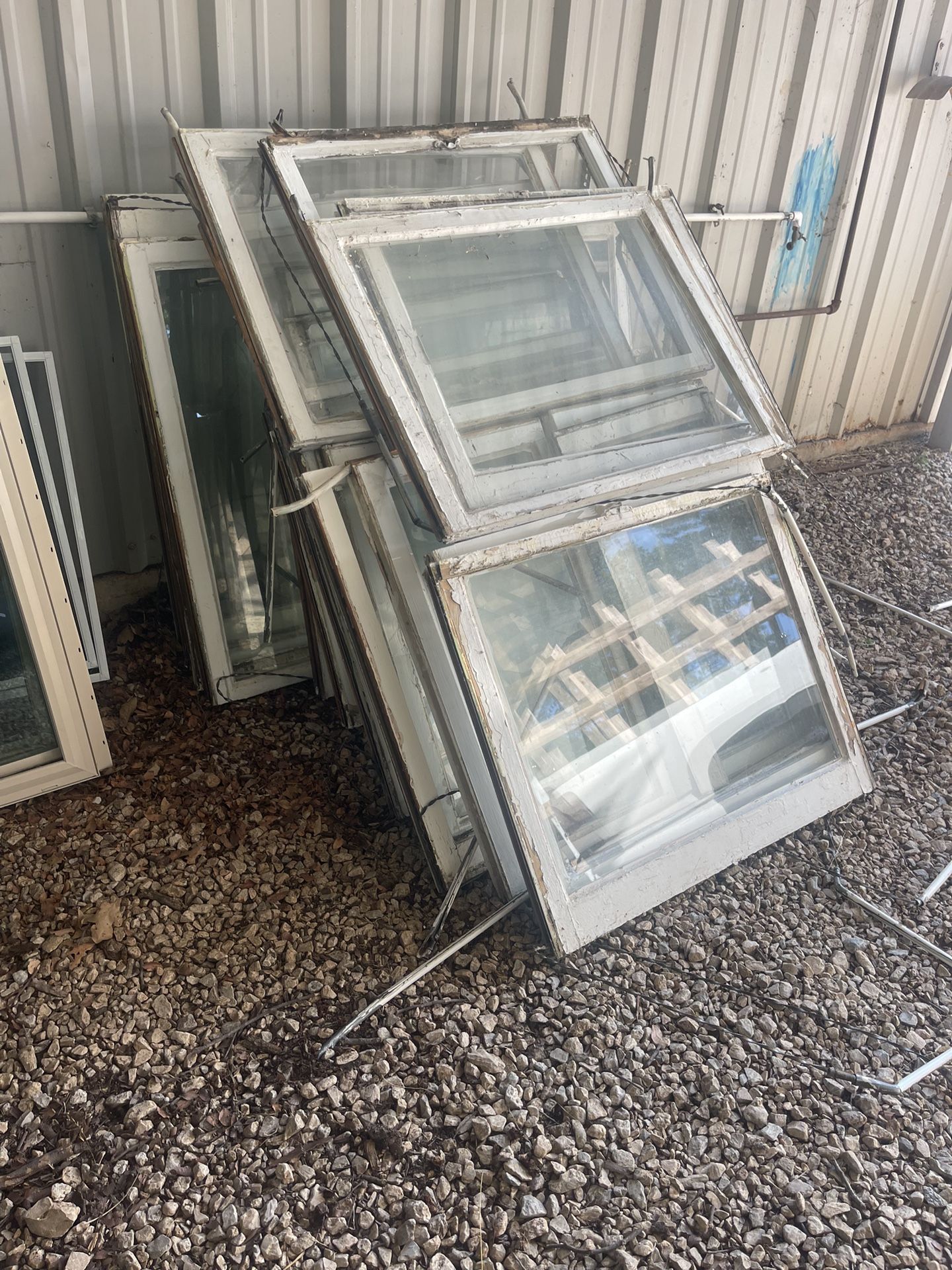 Bundle Of White Wooden Window Sashes