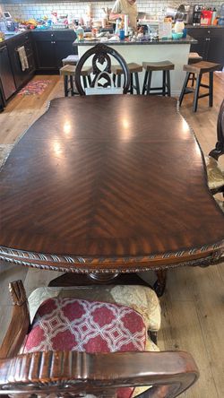 Large Dark Wood Dining Table with Carved Detail