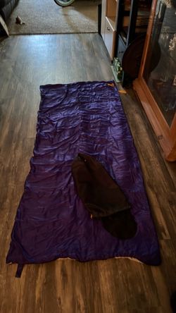 Purple sleeping bag with carry bag