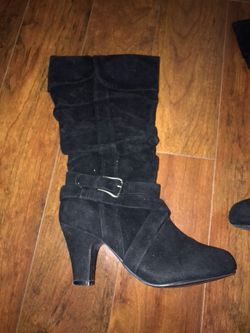pair of black suede heeled boots