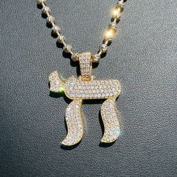 14k yellow gold diamond Chai pendant and 18k yellow gold half of moon chain 22”