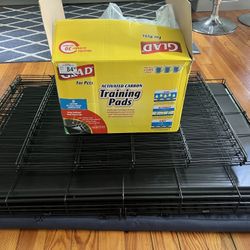 Dog Crate And Fencing And Sleeping Pad