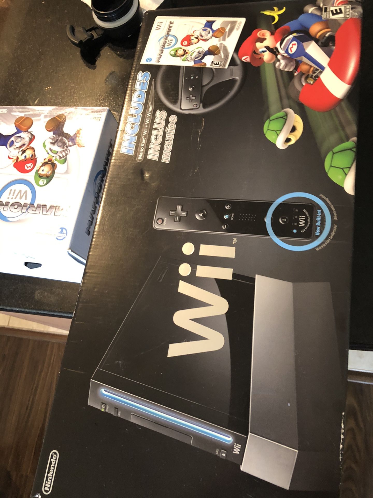 Nintendo wii Mario kart edition brand new never used with extra wheel also never used everything still sealed collector item going for 600+ online