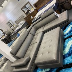 Huge clearance sale. Ibiza gray leather sectional ottoman only $899. Easy finance option. Same-day delivery.