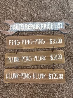 rustic wooden hanging sign titled "Auto Repair Price List that lists humorous sound-based diagnostic