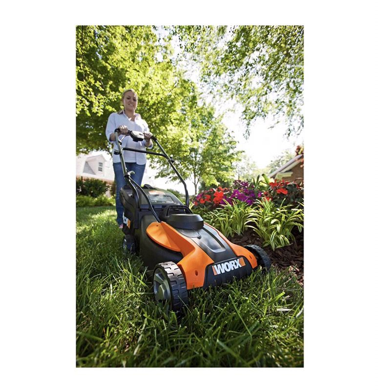 New In Box Worx WG775 14" battery powered 24v 6000 sq ft per charge lawn mower