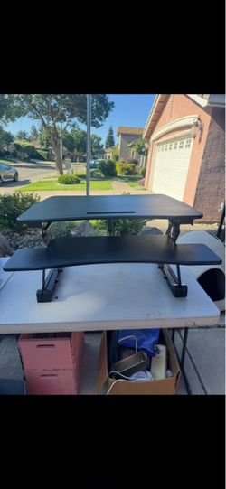 black height-adjustable standing desk