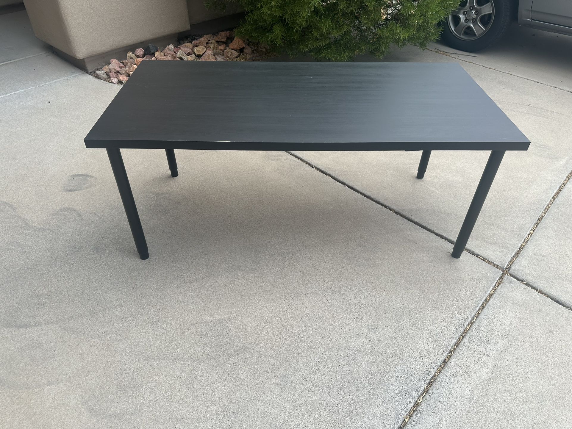 59 Inch by 29 Inch Table With Adjustable Legs