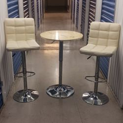 2  cream and chrome stools & table to match
