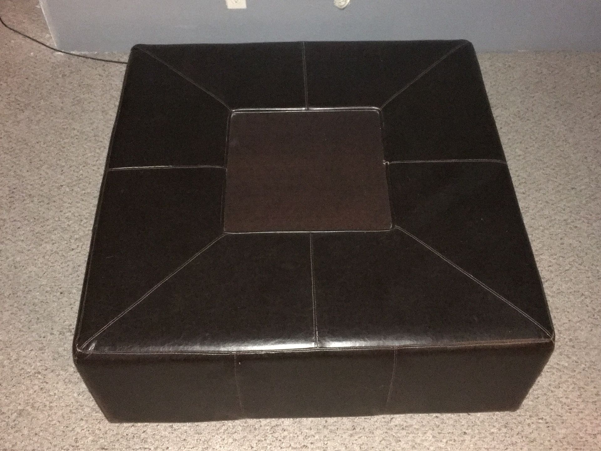 Brown leather/rigid ottoman approx 4’wx4’dx2’h