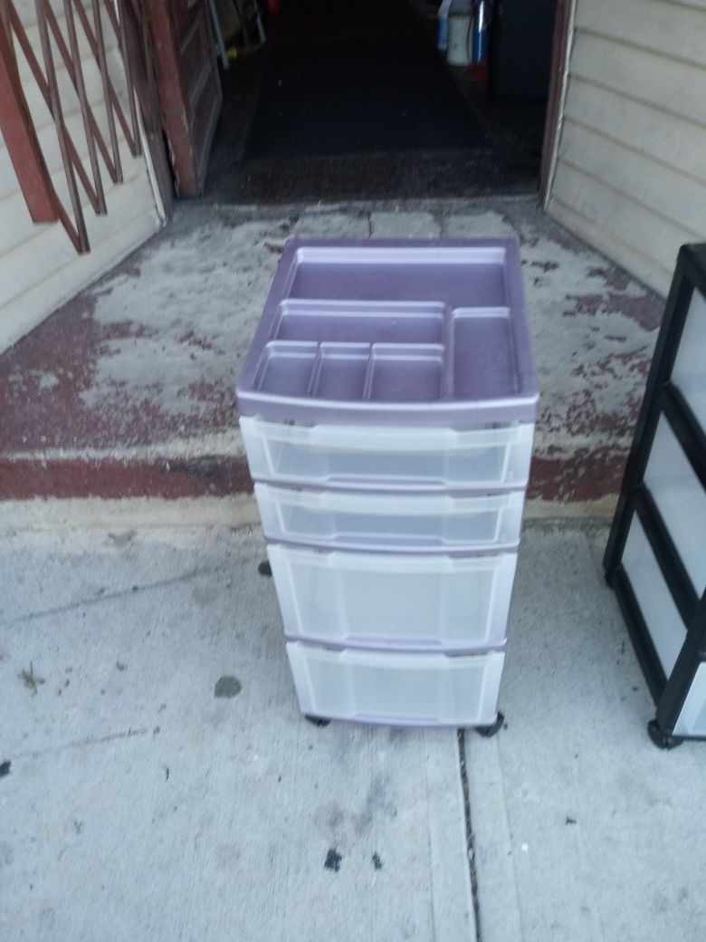 2 clean like new plastic storage containers on wheels
