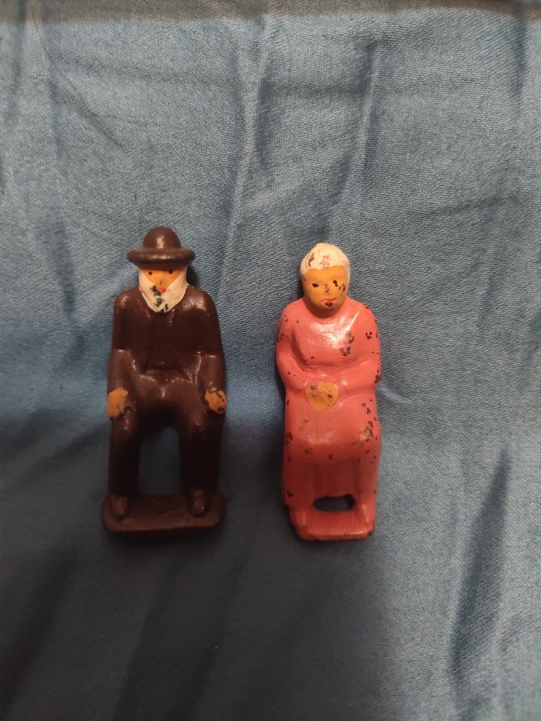 Vintage 1930's Iron Man And Woman Sitting