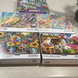 5 Boxes Of 2,000 Pieces Of Puzzles 
