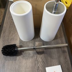 Toilet brushes with holders.