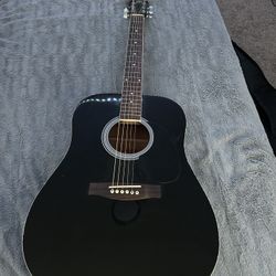 black acoustic guitar