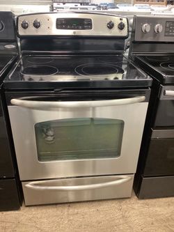 GE 30 in. 5.3 cu.ft. 4 Burners Freestanding Electric Glass Top Range